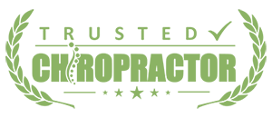 A green emblem with laurel leaves, stars, and the text “Trusted Chiropractor,” including a checkmark and a spine graphic, representing credibility and professional certification.